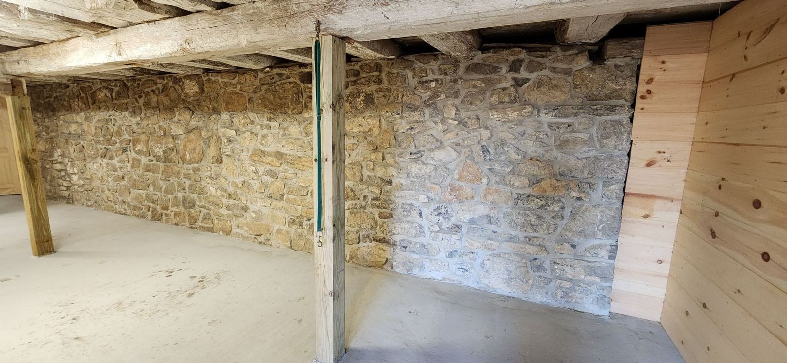 A restored historic stone and brick building by Poor Boys' Enterprises